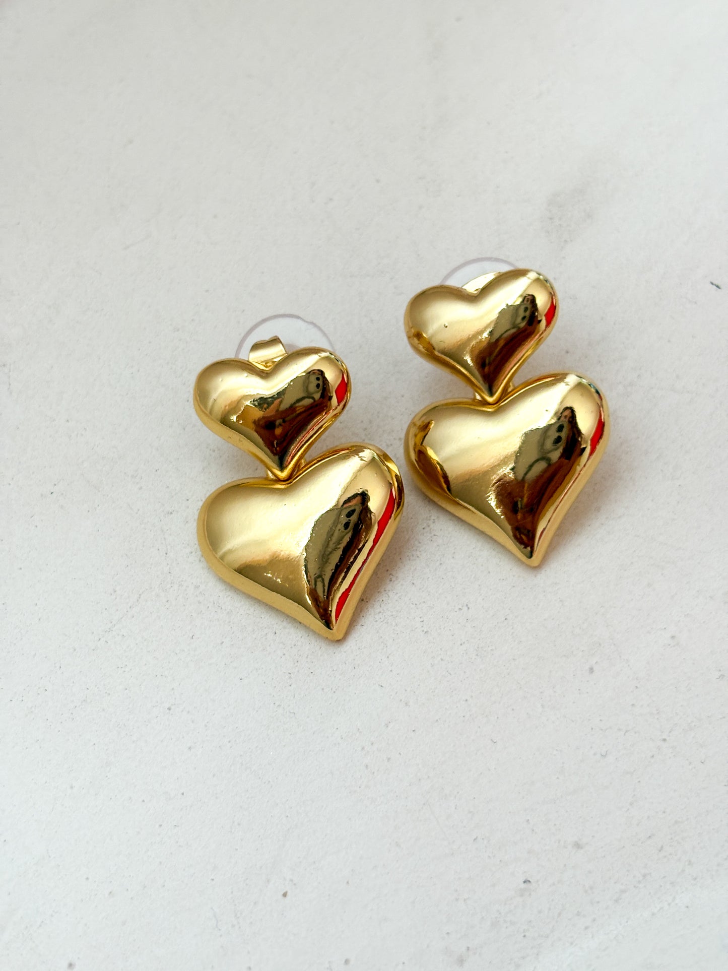 Aretes corazón doble