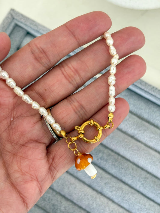 Collar perlas timón